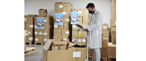 A health worker at a warehouse ensures the delivery of essential medication to people in need, with the support of the EU and WHO.