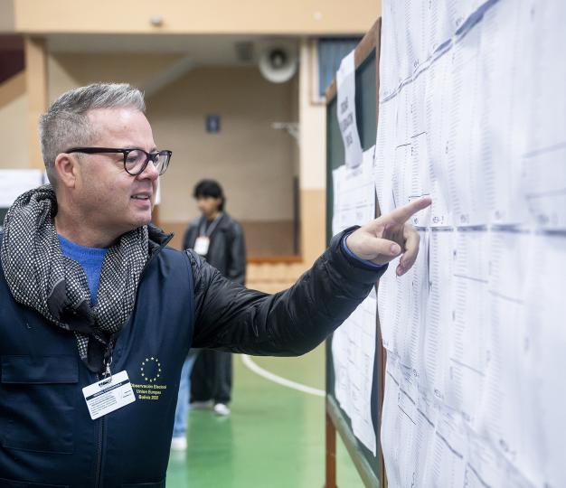 An EU Election Observer working in the field