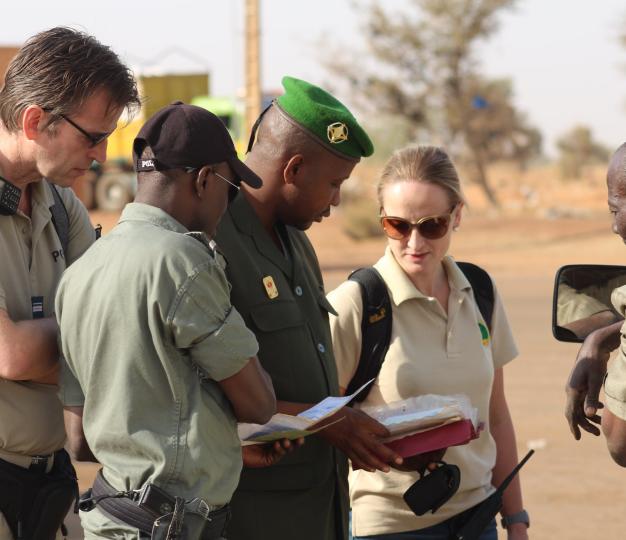 military staff looking at papers