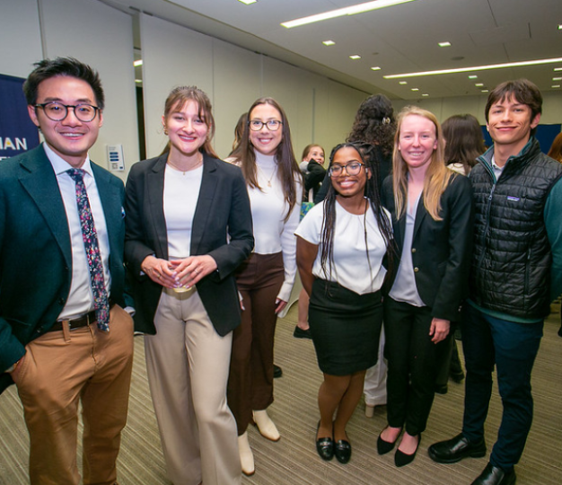 A group of students pose at the Delegation office.
