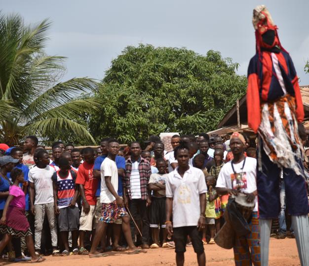 Dancer celebrates the coming of electricity to Peace Island Community