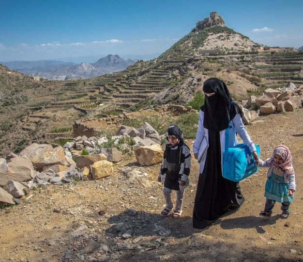 A health worker visiting a remote village to provide primary health services