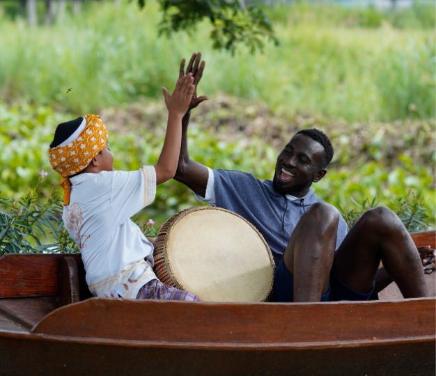 People laughing and doing a high-five